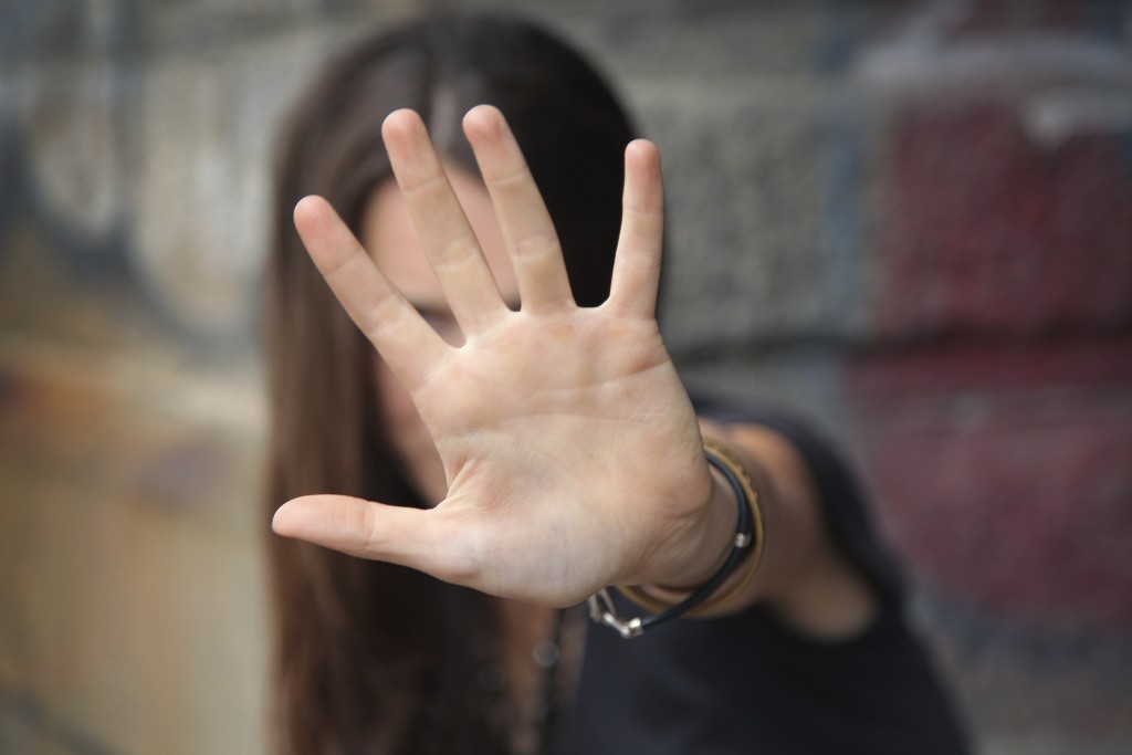 woman-with-hand-up-1024x683